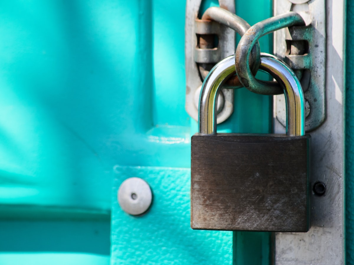 A padlock securing a door