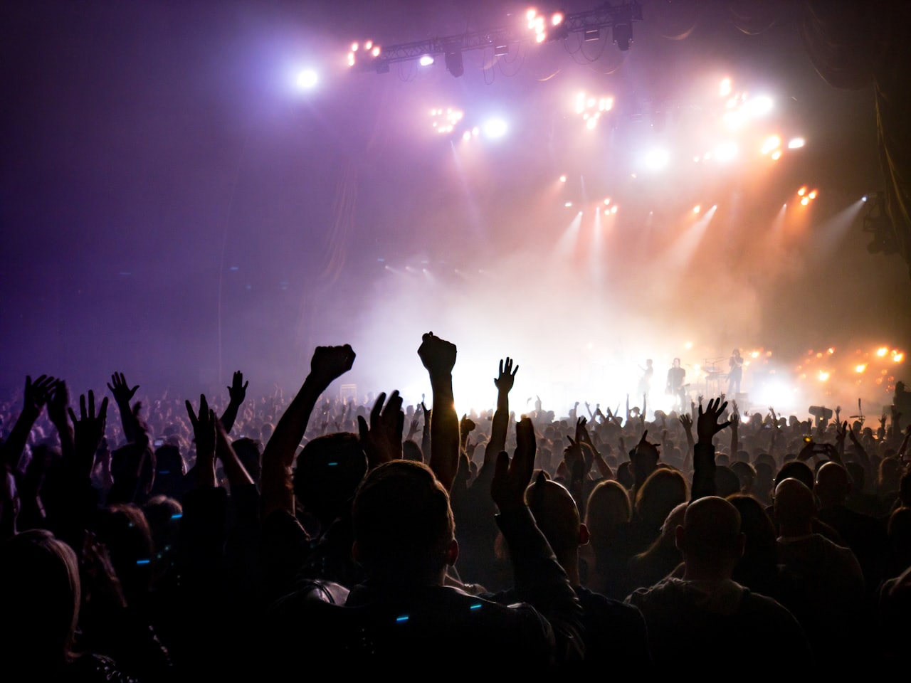 A live audience facing a lit stage